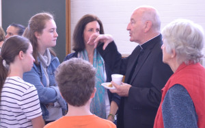 Reception at school hall after Church blessing, Nov 29, 2015. Bishop Terry has a captive audience  Click to enlarge pic.